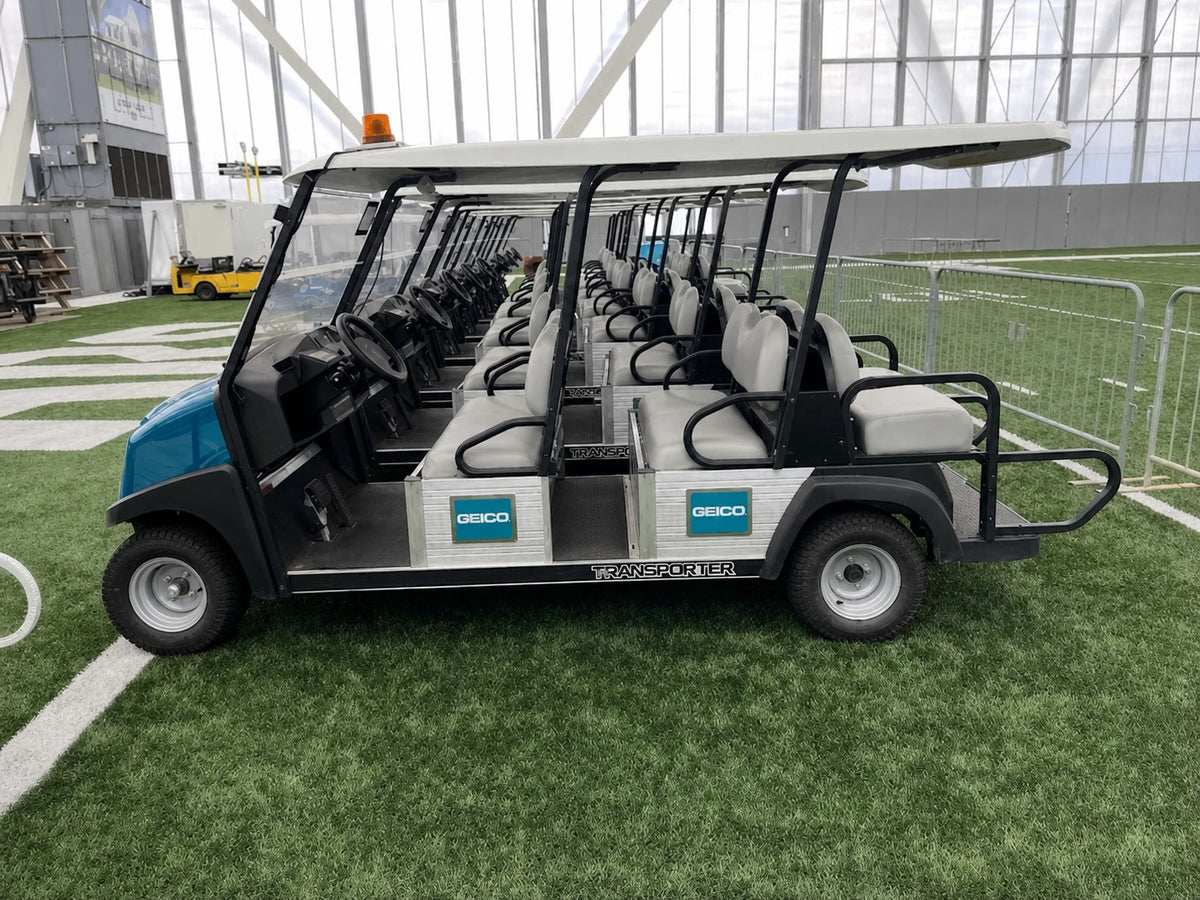 Clean Club Car Transporter passenger fleet with GEICO branding