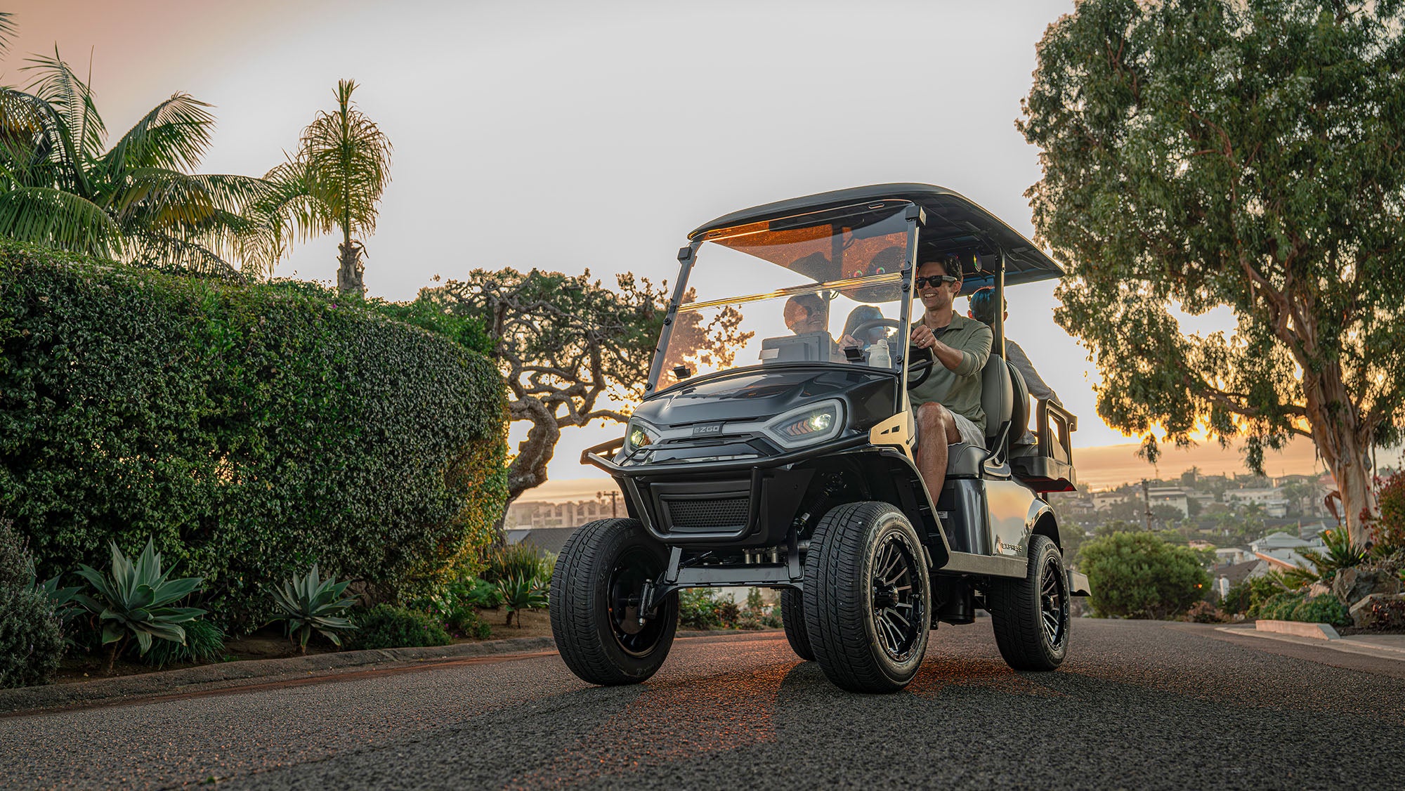 E-Z-GO Express 4 driving through a neighborhood