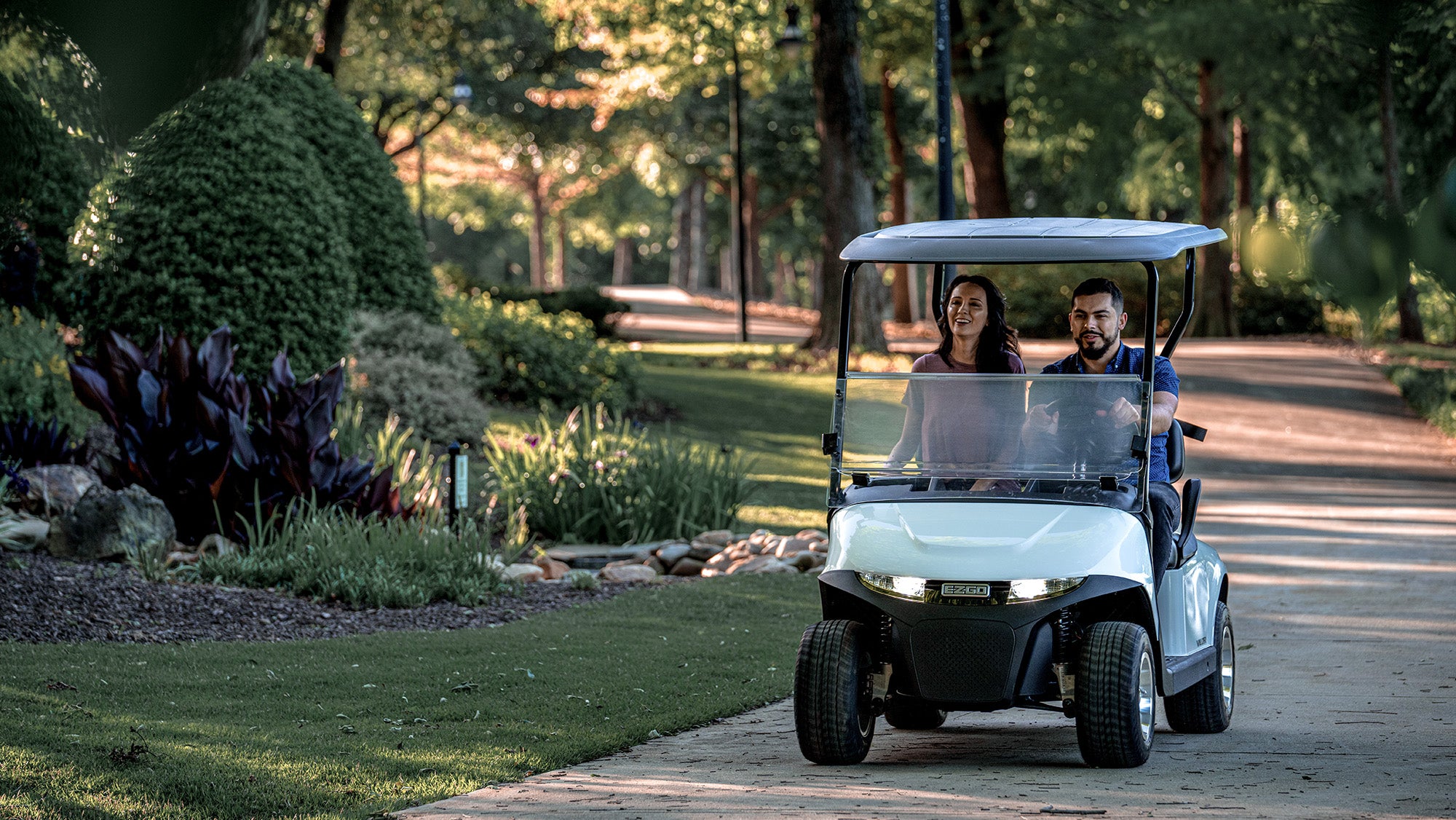 E-Z-GO Valor two-passenger golf cart in use - MY2024